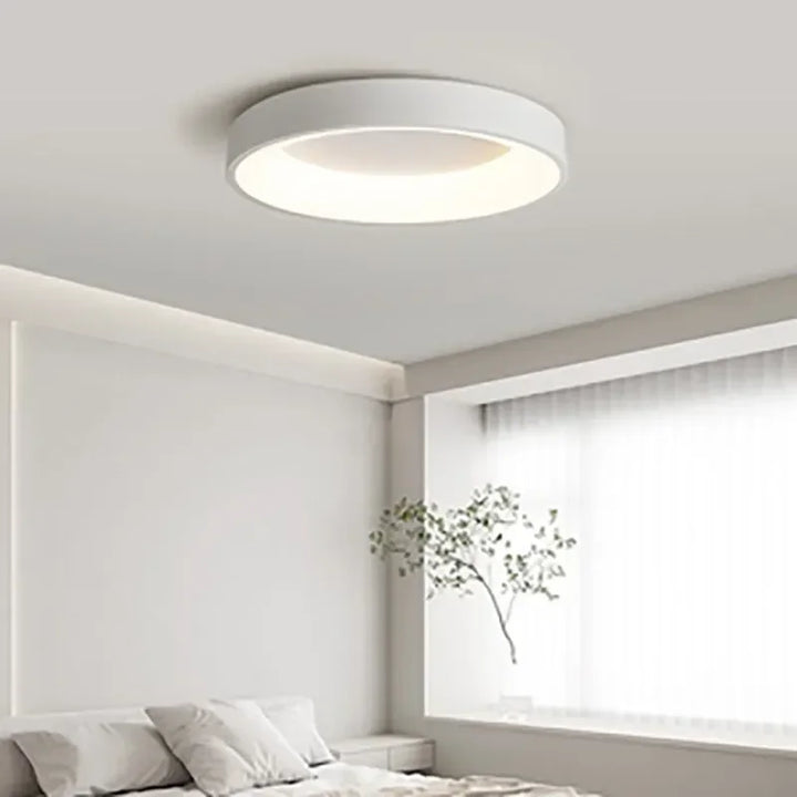 Modern Nordic LED ceiling light, sleek round minimalist design, ideal for living room or bedroom.