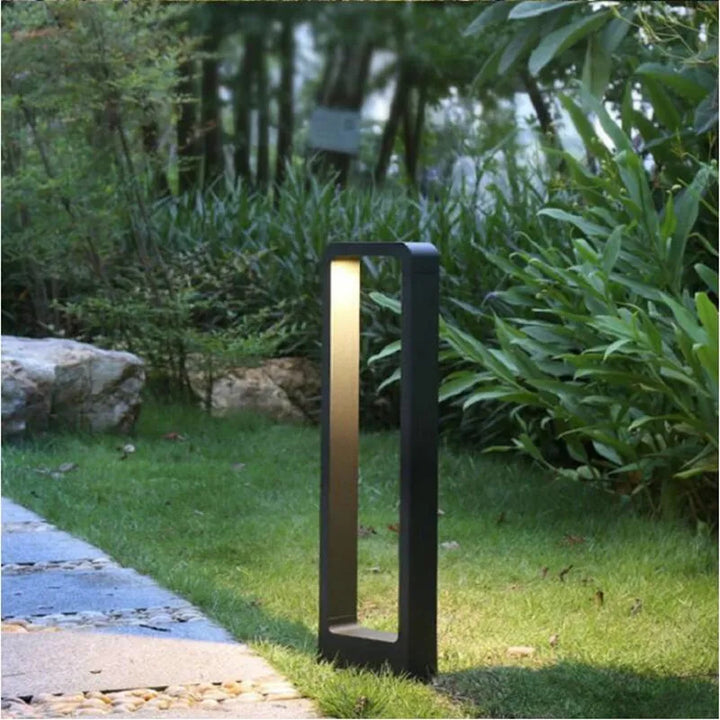 Sleek modern LED bollard light for gardens, pathways & yards. Waterproof, energy-efficient exterior lighting.