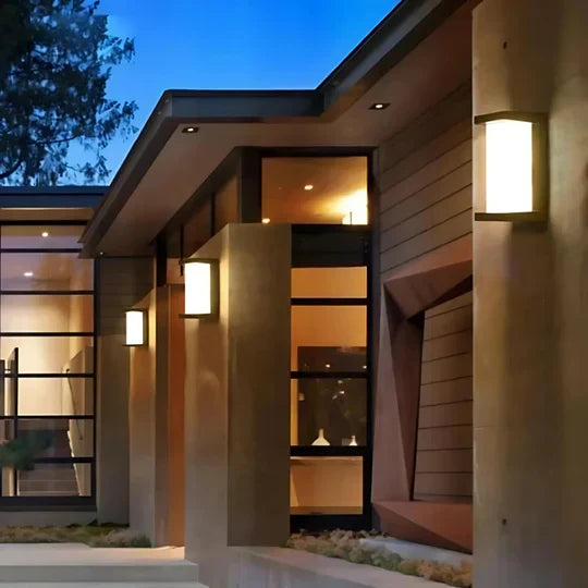 Modern outdoor LED wall lamp with motion sensor for enhanced home security. Weather-resistant exterior light.