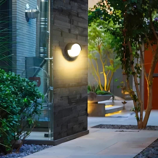 Durable outdoor LED wall lamp, perfect for porch, patio, or garage. Features motion sensor for smart security.