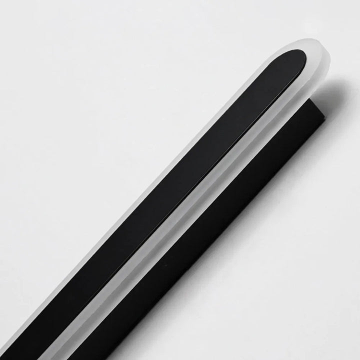 Slim profile modern outdoor LED wall lamp, weather-resistant, casting linear light for elegant pathways.