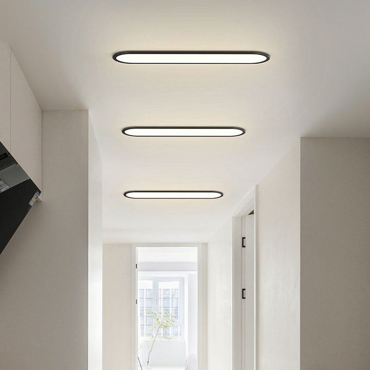 Dimmable modern oval LED ceiling light, energy-efficient for contemporary spaces.