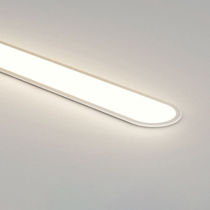White oval LED flush mount ceiling light, modern and dimmable for interior lighting.