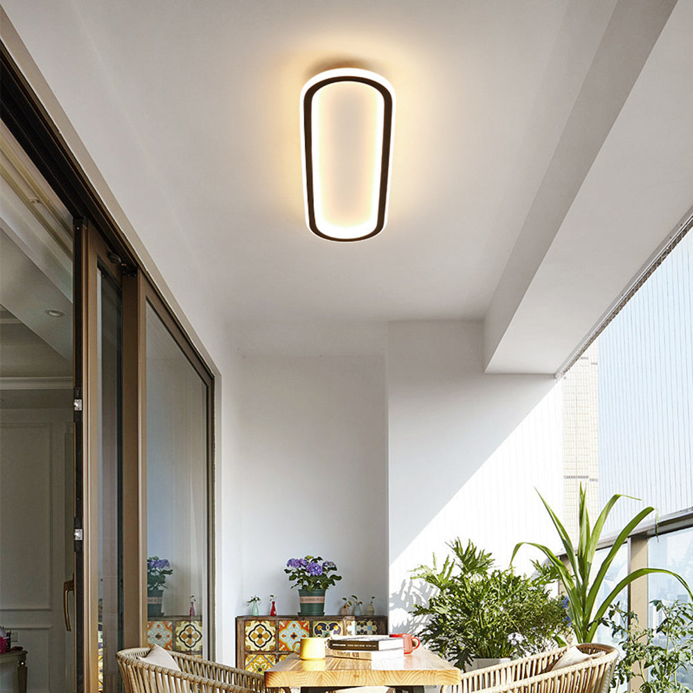 Black Oval LED Flush Mount Ceiling Light, versatile and modern home decor.