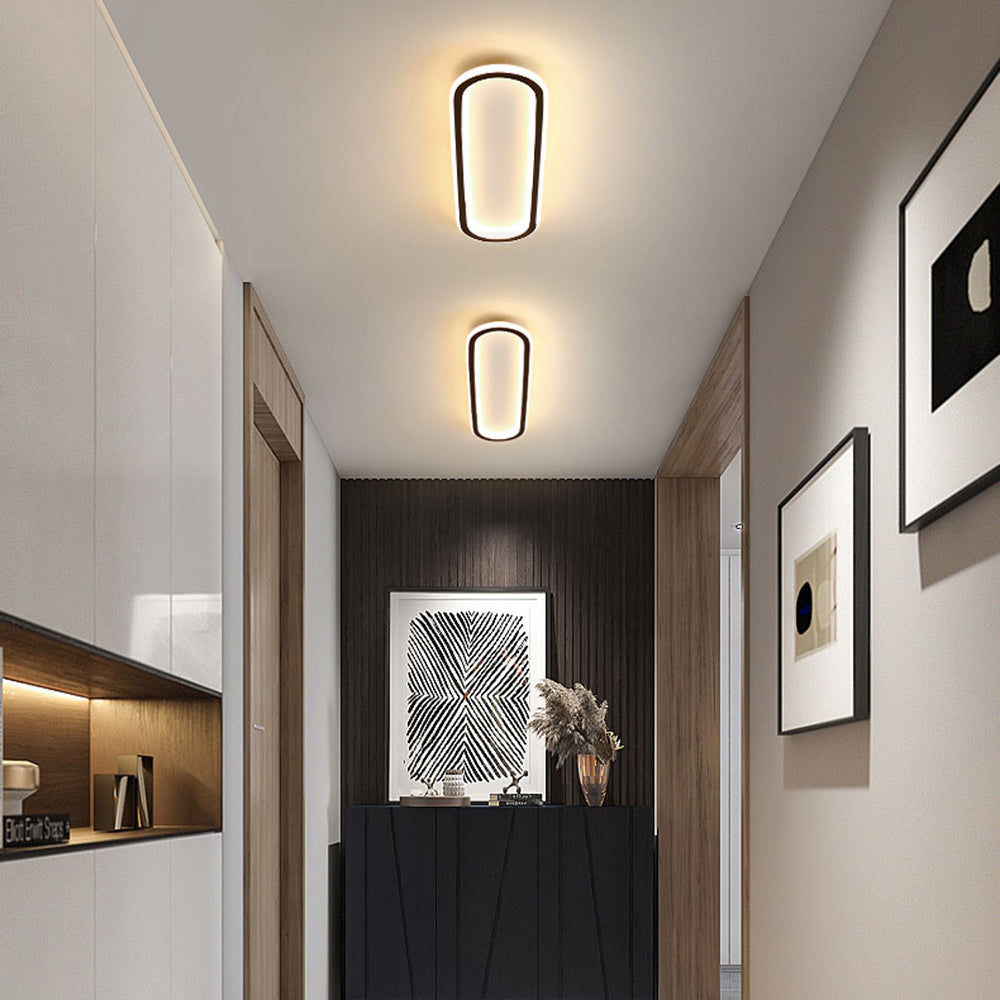Black finish Modern Oval LED Flush Mount Ceiling Light, perfect for interior lighting.