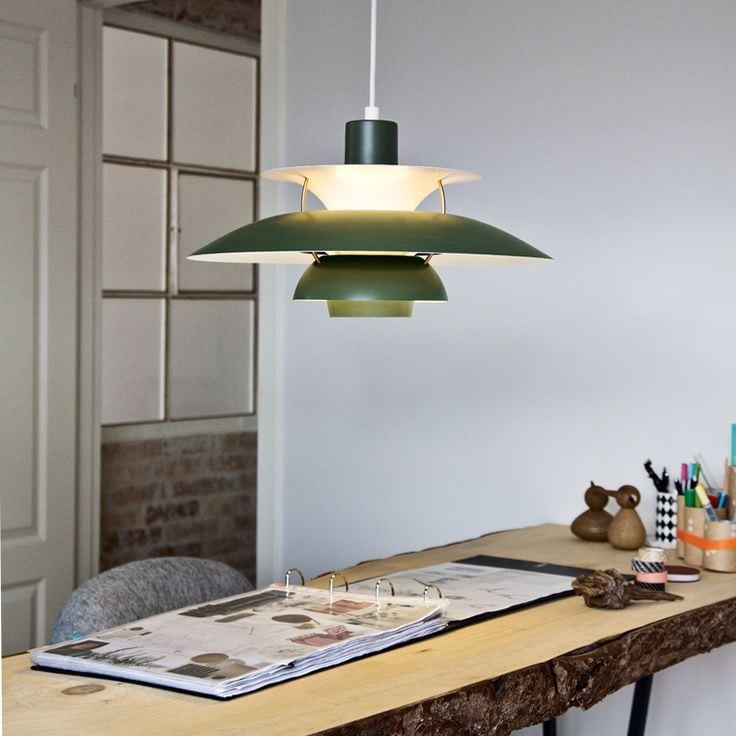 Paxano modern pendant, warm white light, creates inviting dining room atmosphere. Home decor accent.