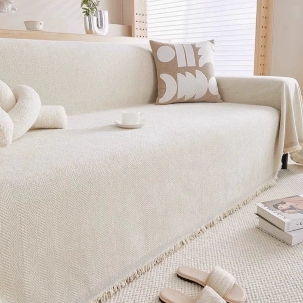 Minimalist modern sofa cover for elegant living room decor. Pet-friendly couch protector, solid color, easy care.