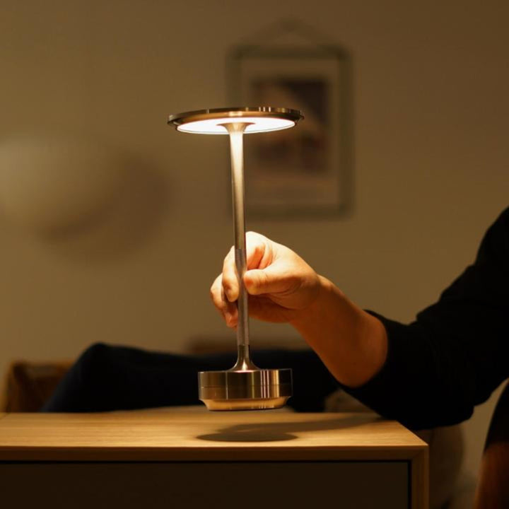 Touch control cordless lamp providing customizable dimmable light, perfect modern accent for any surface.