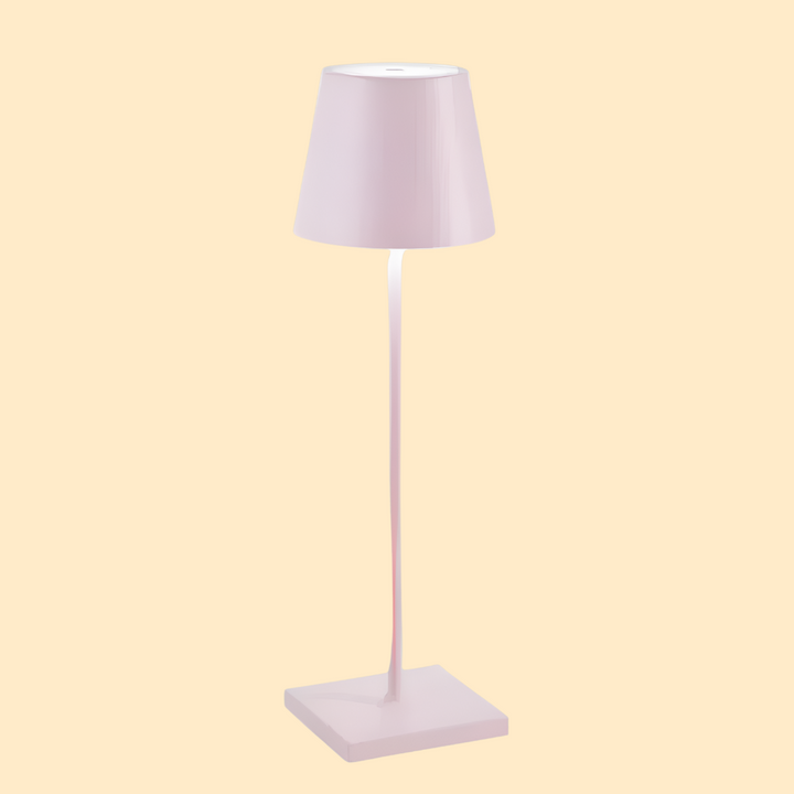 Modern rechargeable LED table lamp provides soft ambient lighting. Wireless and portable for versatile use.
