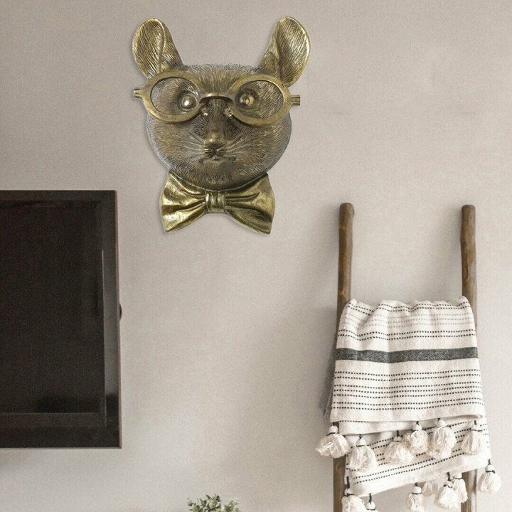 Hand-painted resin giraffe wall decor, elegant animal art for sophisticated interior design.