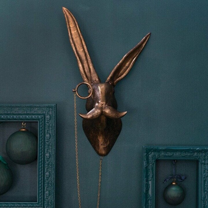Rustic resin wolf wall sculpture, striking wildlife art for a nature-inspired home.