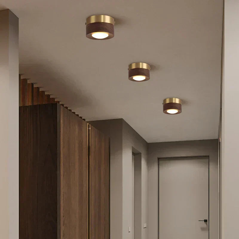 Walnut wood LED ceiling light with a modern, minimalist round design. Energy-efficient home decor.
