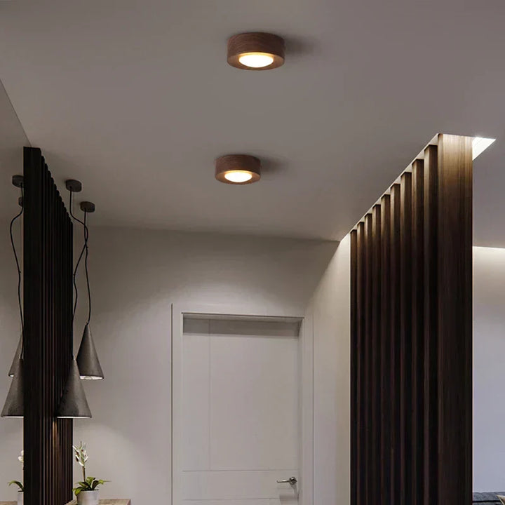 Contemporary round wooden LED ceiling lamp. Walnut finish for elegant, bright interior lighting.