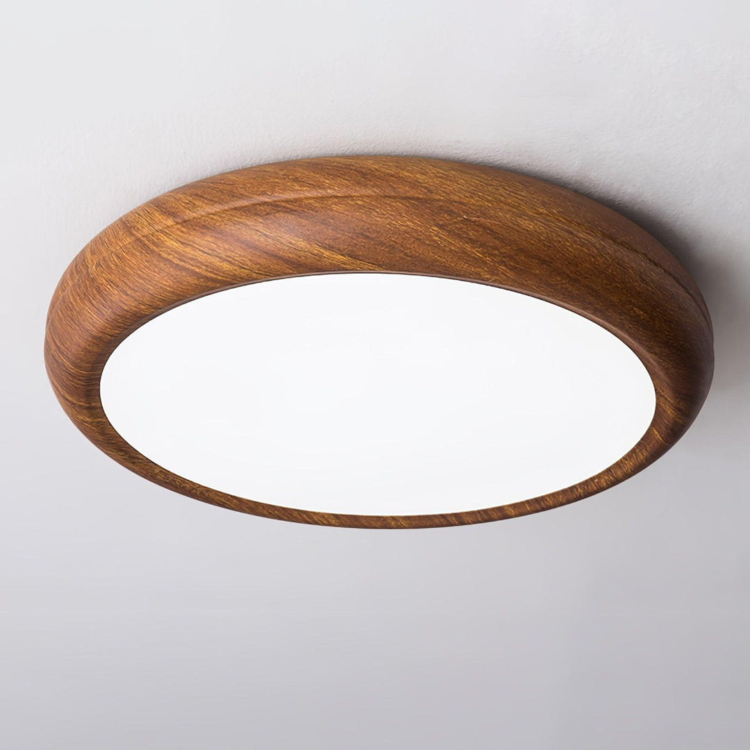 Sleek modern round LED flush mount ceiling lamp, provides efficient lighting.