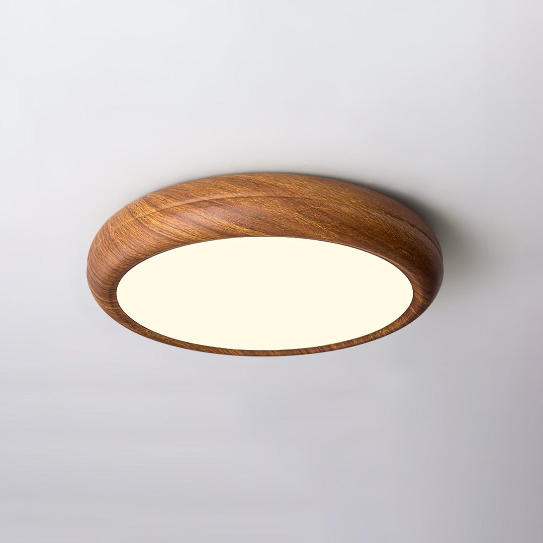 Contemporary round LED flush mount, warm light setting, inviting home atmosphere.
