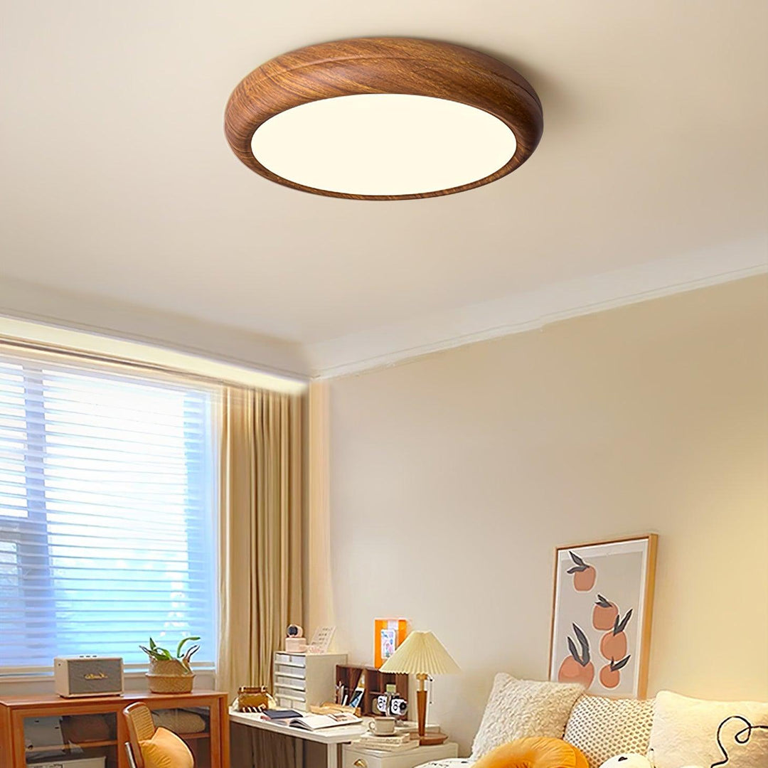 Sleek round LED flush mount ceiling light with cold light, contemporary interior.