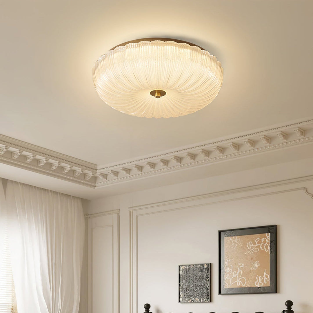 Contemporary flush mount LED ceiling light with rippled glass, perfect for a clean, modern aesthetic.