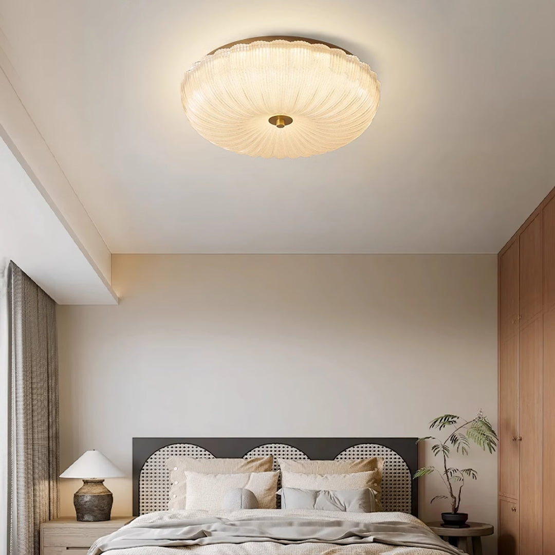 Sleek flush mount LED ceiling light, round design & rippled glass, perfect for modern home interiors.