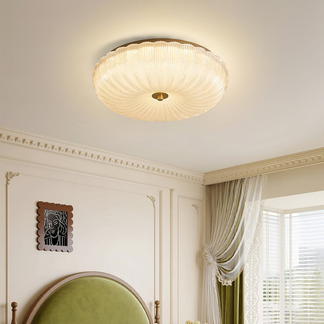 Minimalist modern round LED flush mount ceiling light, features stylish rippled glass diffuser.