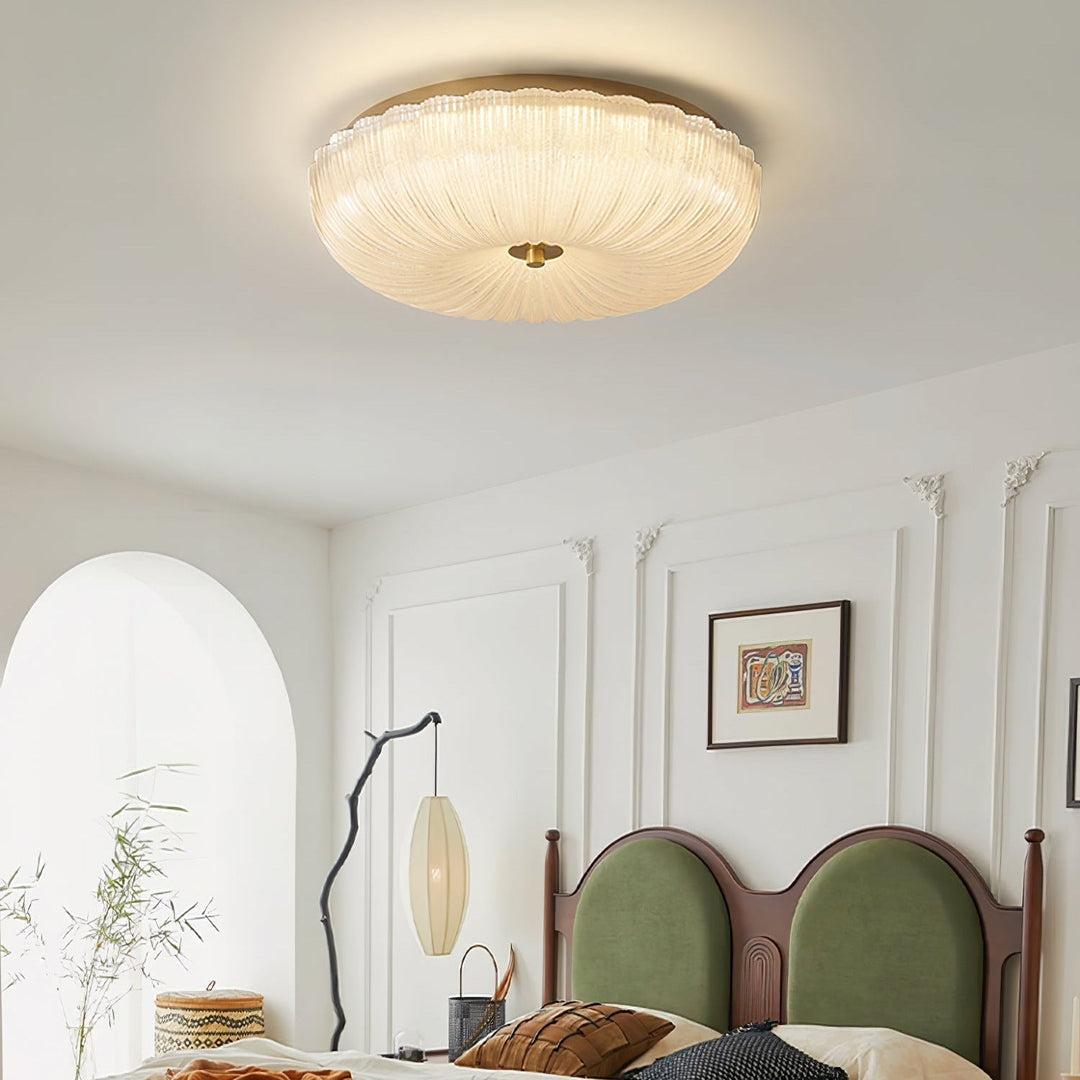 Bright LED flush mount ceiling light, round shape & rippled glass, great for bedroom or hallway decor.
