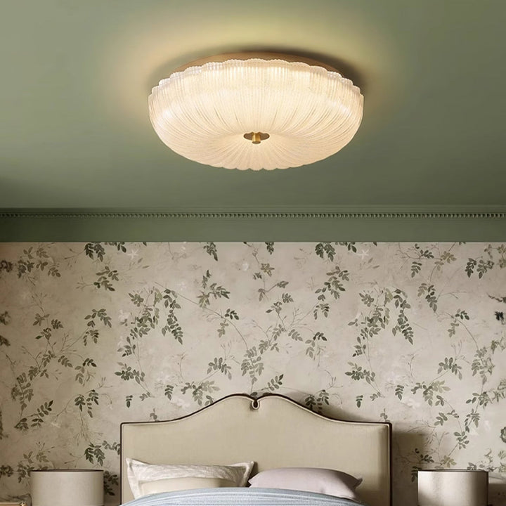 Flush mount round LED ceiling light for modern homes, offers adjustable light with a sleek design.