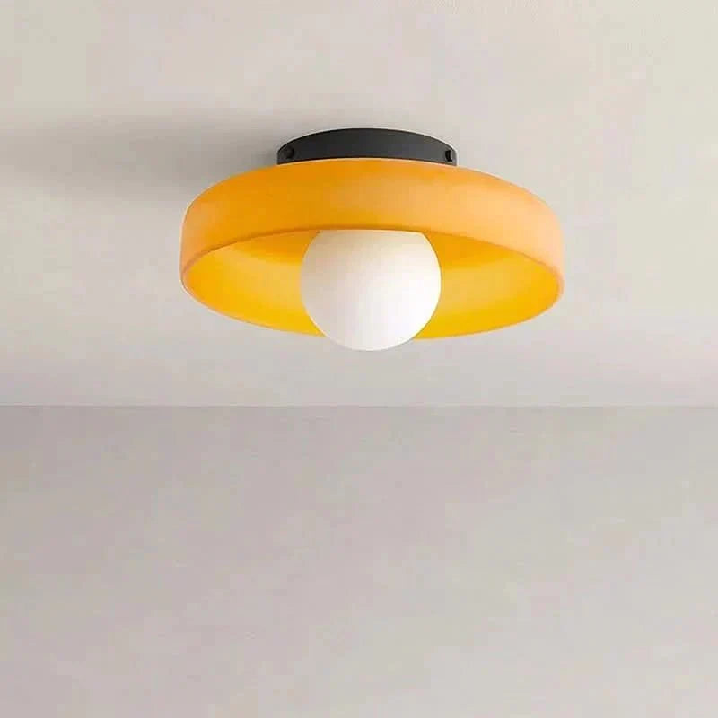 Chic yellow glass ceiling lamp, modern Scandinavian design, ideal for atmospheric home interior lighting.