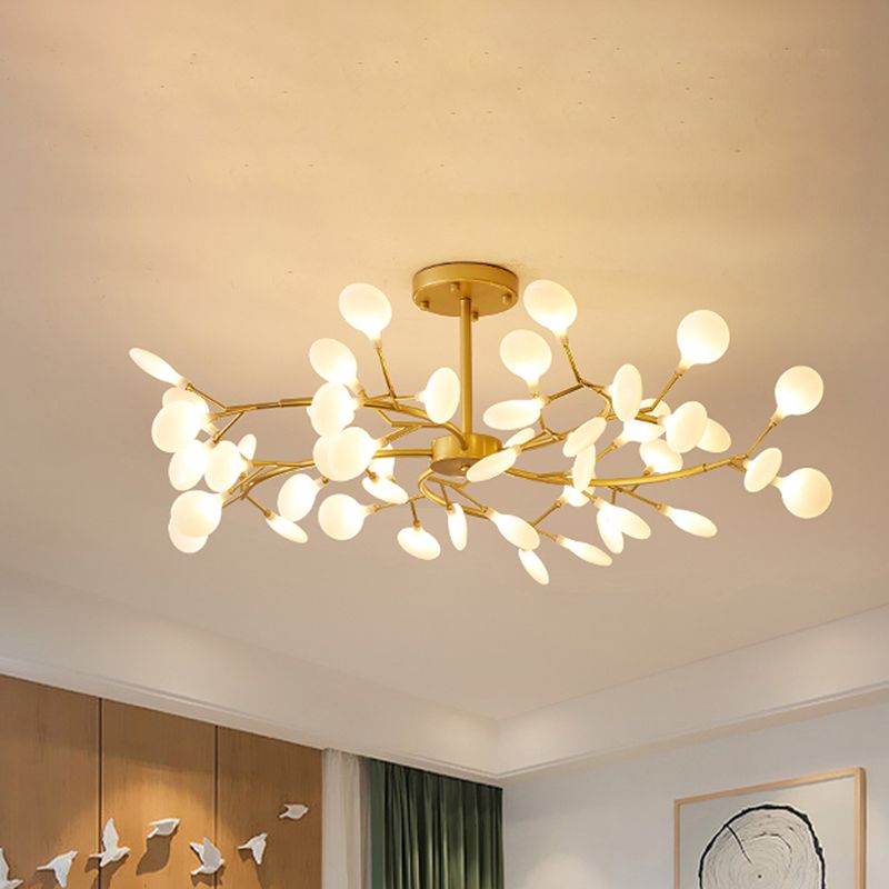 Modern ceiling light, gold branch design, adds elegance to any room.