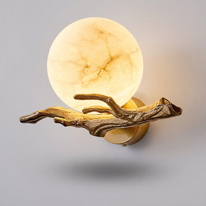 Elegant marble and copper wall lamp offering ambient LED lighting, enhancing modern home decor.