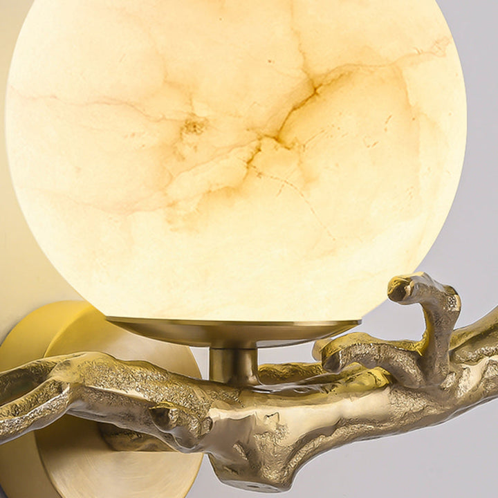 Stylish LED wall light featuring a unique marble and copper design, adding a sculptural touch to any room.