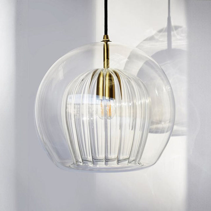 Versatile contemporary sphere pendant light. Single head fixture brightens kitchen, dining, or entryway.