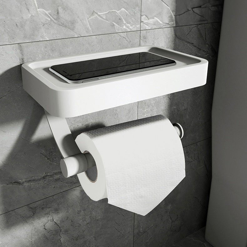 Sleek stainless steel toilet paper holder and storage shelf combo, enhancing modern bathroom style and utility.