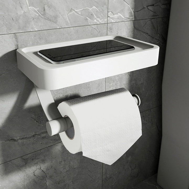 Sleek stainless steel toilet paper holder and storage shelf combo, enhancing modern bathroom style and utility.