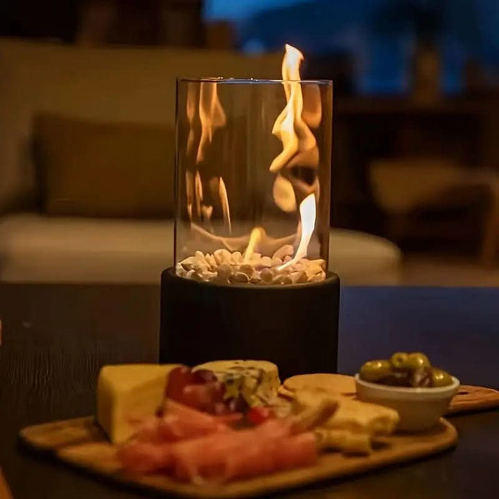 Elegant tabletop bioethanol fire pit with real flame; a modern, portable, and clean burning accent.