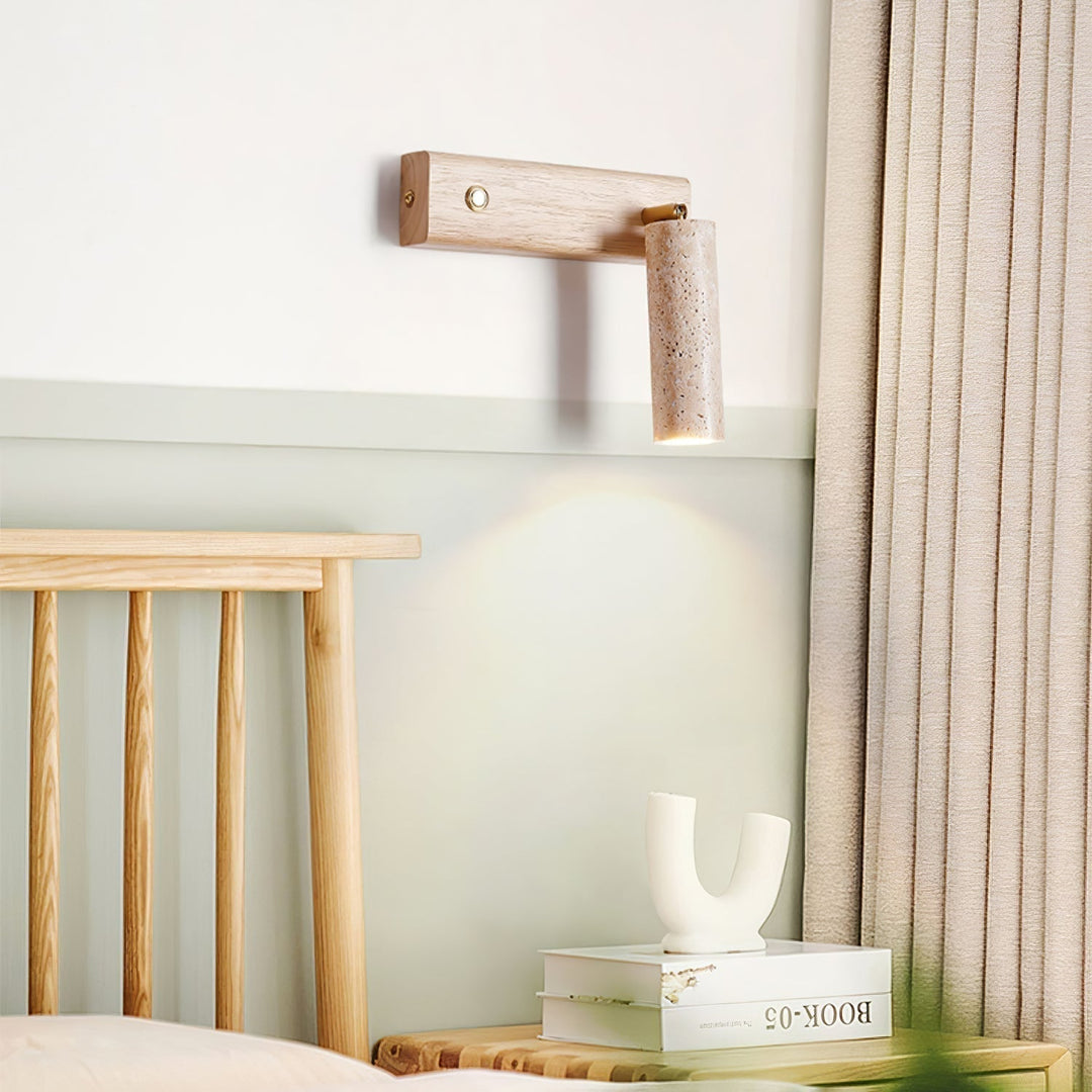 Bedroom wall-mounted reading lamp, modern design, combining travertine & wood for soft illumination.