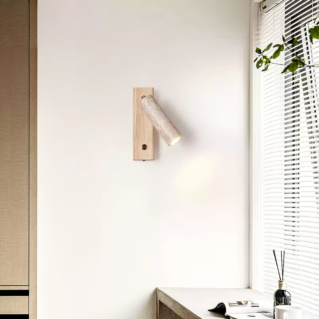 Minimalist wall reading light, natural travertine and wood, enhances modern home decor and ambiance.