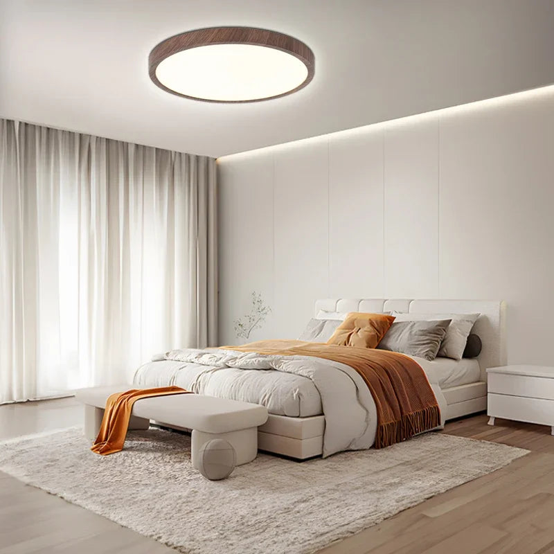 Minimalist circular LED ceiling light with an ultrathin profile, ideal for contemporary interior design.
