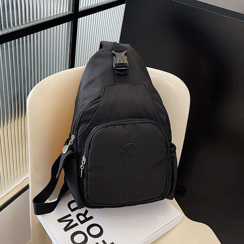 Modern unisex sling backpack, compact & water-resistant, ideal for everyday carry. Sleek crossbody travel bag.