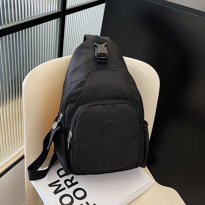 Modern unisex sling backpack, compact & water-resistant, ideal for everyday carry. Sleek crossbody travel bag.