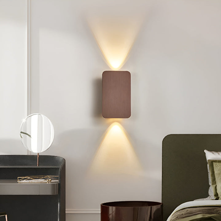 Sleek minimalist LED wall lamp casting beautiful up & down light, enhancing modern home aesthetics.