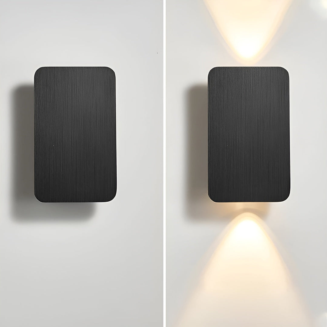 Stylish black modern LED wall lamp with upward and downward light beam for elegant home ambiance.