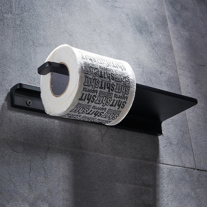 Space-saving bathroom organizer: wall-mounted toilet paper holder with integrated phone storage shelf.