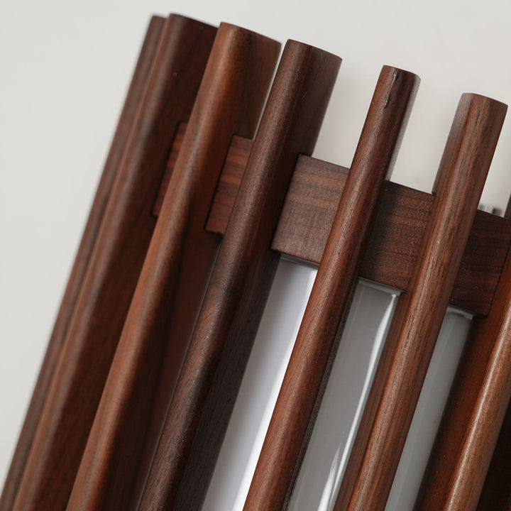 Walnut wood modern wall light, sleek aesthetic for contemporary decor.