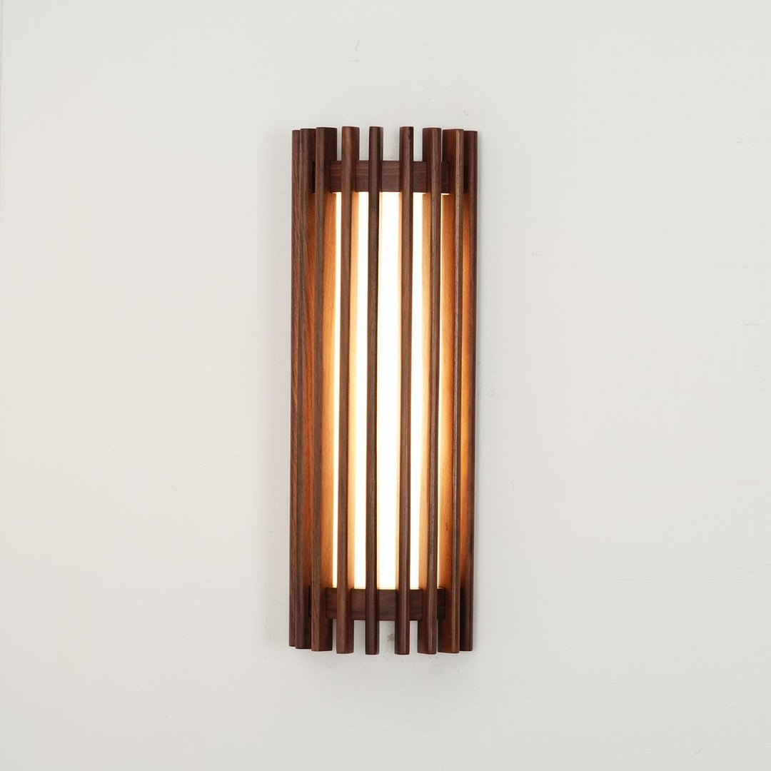 Sleek wood wall lamp, modern style, provides gentle indoor ambient lighting.