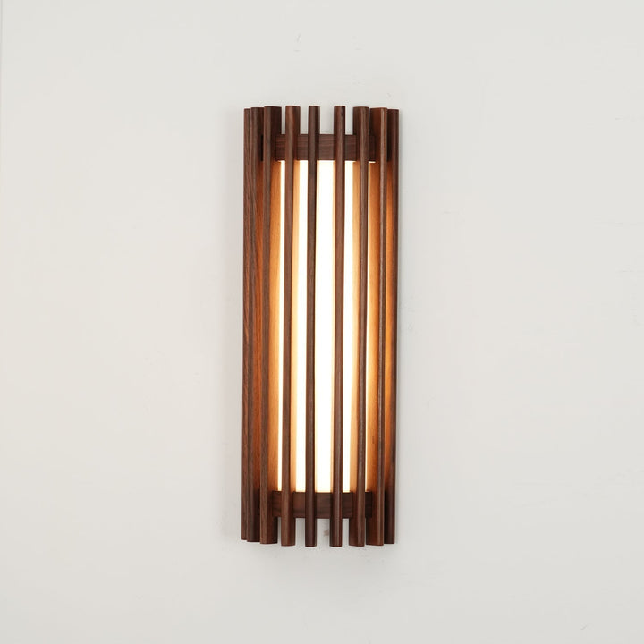 Sleek wood wall lamp, modern style, provides gentle indoor ambient lighting.