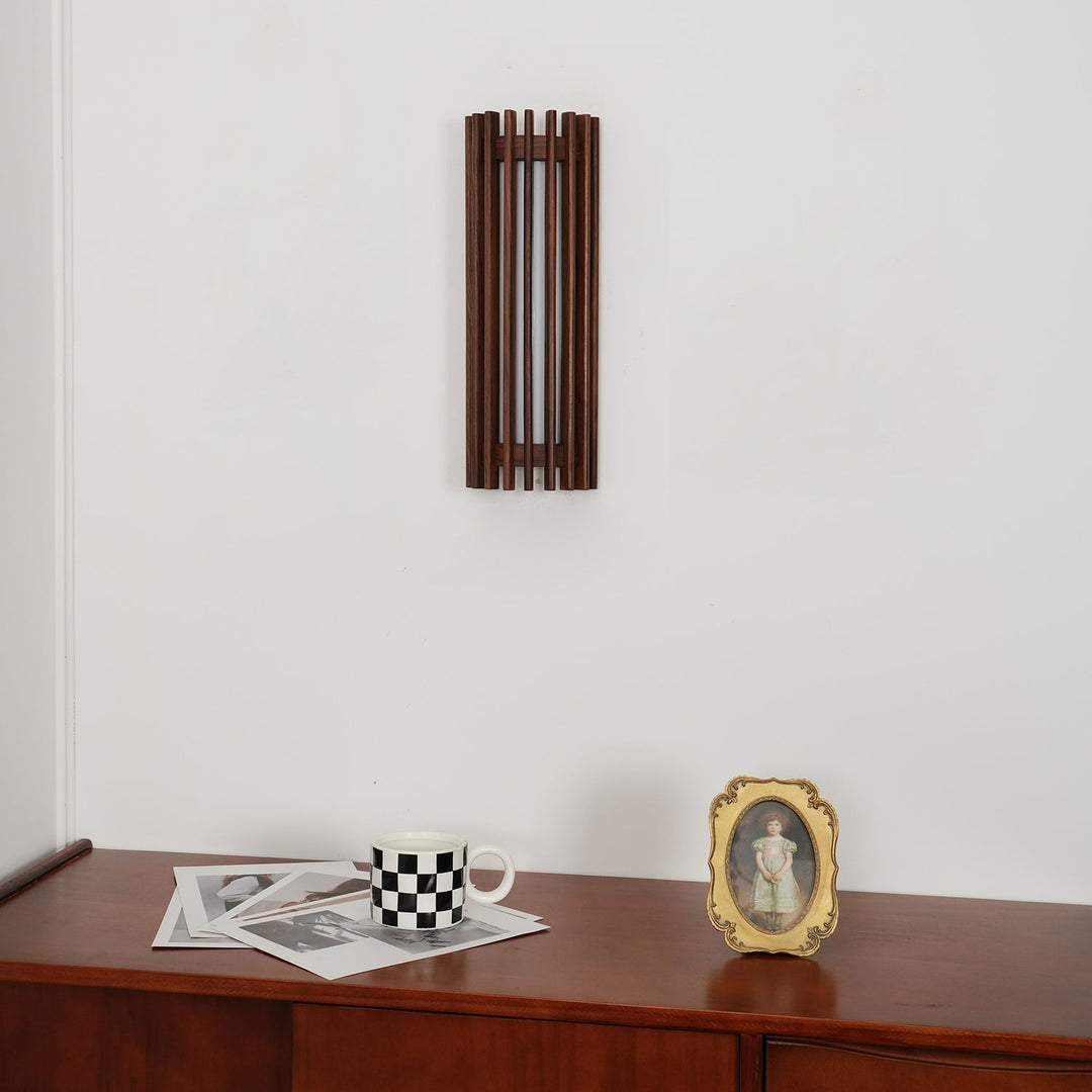 Walnut wood LED wall light, modern home decor accent for indoor spaces.