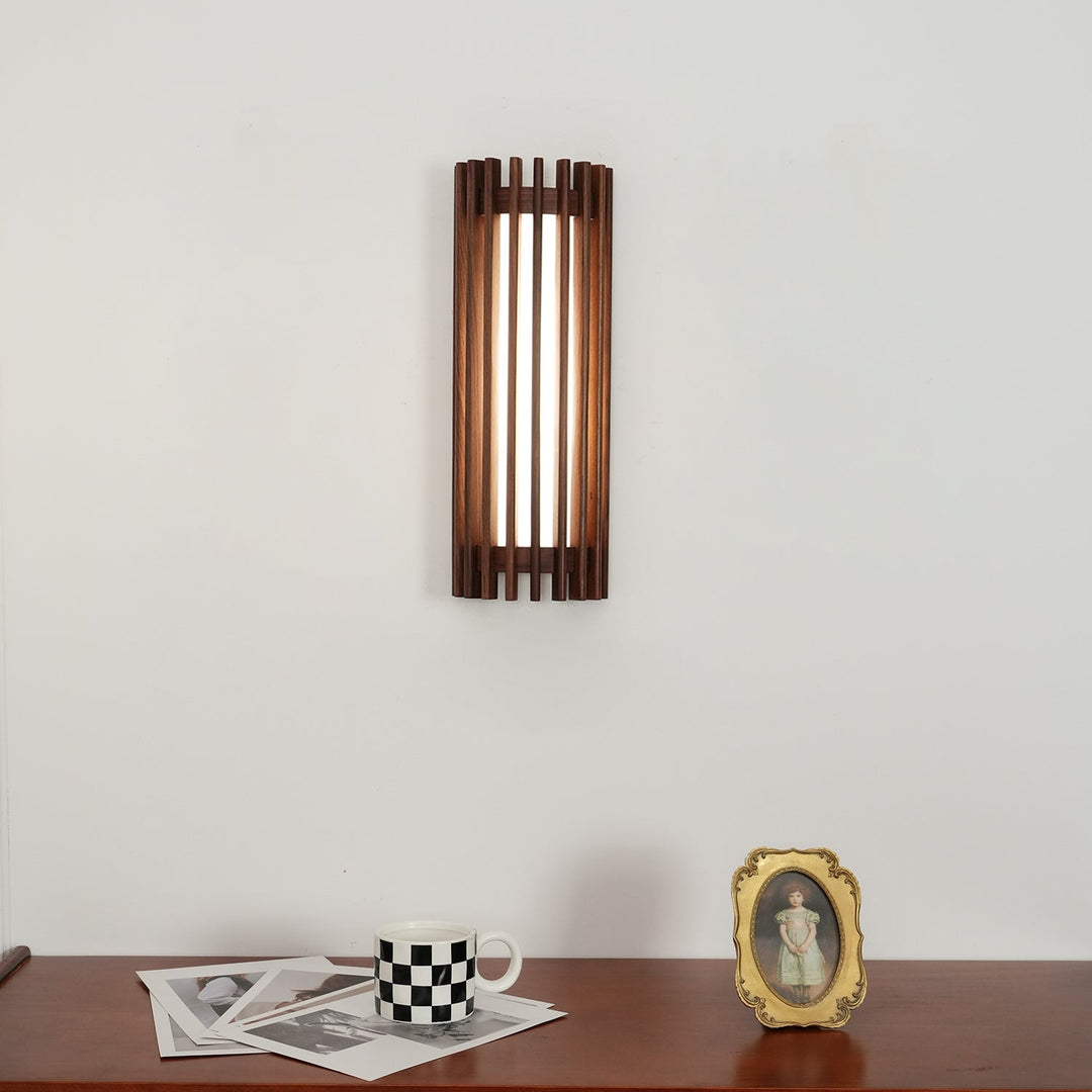 Elegant walnut wood wall light, contemporary design with acrylic diffuser.