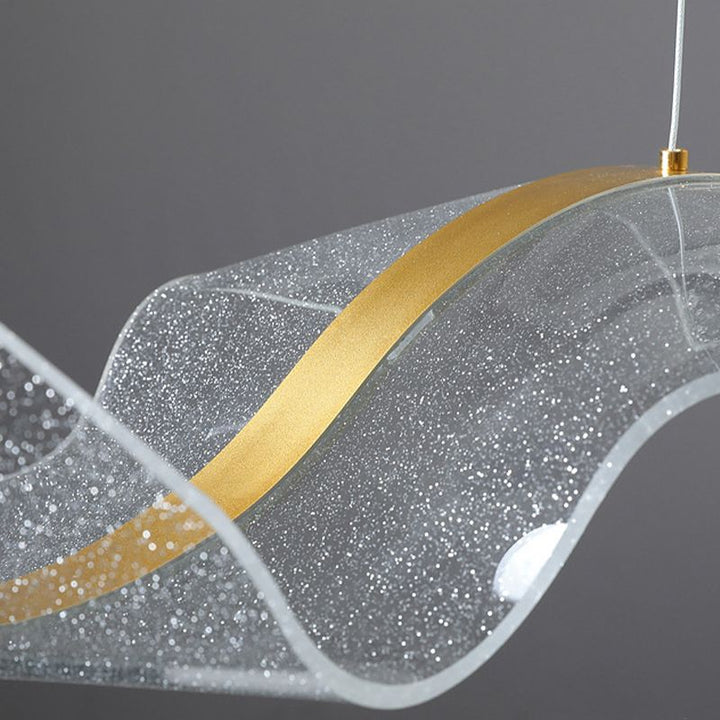 Contemporary Wave LED pendant light with a bright white light, perfect for accenting any modern room.