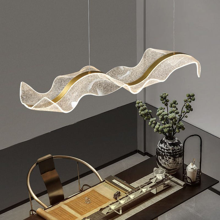 Stylish Wave LED ceiling pendant providing dimmable white light, perfect for modern home lighting.