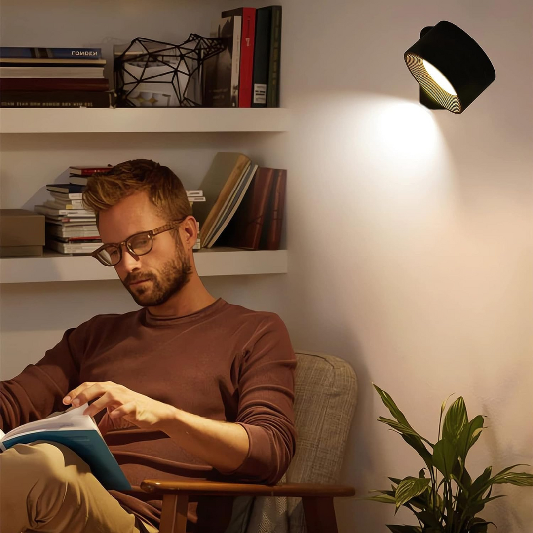 Modern LED bedroom wall light, wireless & rechargeable with touch dimming. 360° adjustable light.
