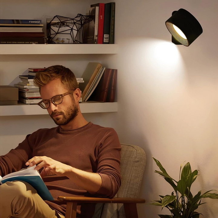 Modern LED bedroom wall light, wireless & rechargeable with touch dimming. 360° adjustable light.